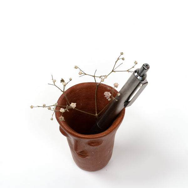 red-clay-face-cup-top-view