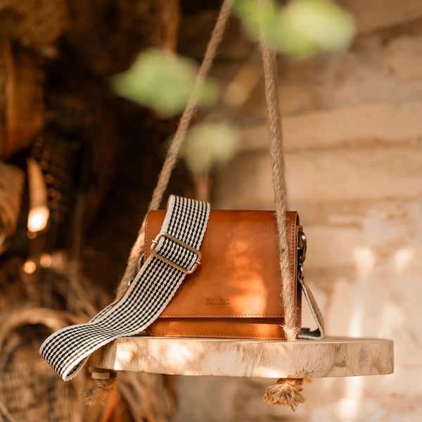 sleek-leather-satchel-checkered-strap