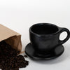 black-clay-cup-with-coffee-beans