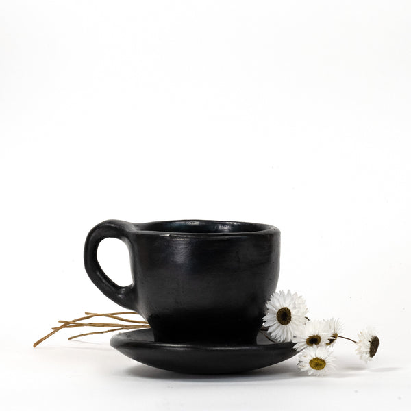 black-clay-mug-with-white-flowers